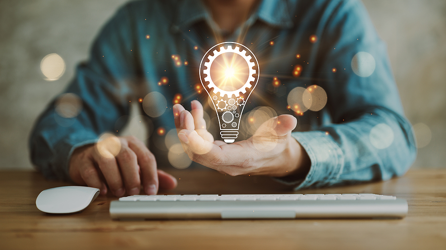 automotive executive at desk with lightbulb